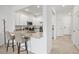 Modern kitchen with breakfast bar, stainless steel appliances, and white cabinetry at 14835 Lyla Ter, Bradenton, FL 34211