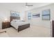 A bright, comfortable bedroom with a ceiling fan and serene interior design at 14835 Lyla Ter, Bradenton, FL 34211