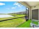 Relaxing screened patio offers a tranquil view of the lake and lush green space at 14835 Lyla Ter, Bradenton, FL 34211