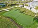 Scenic view of a private putting green, perfect for golf enthusiasts to practice their short game at 14835 Lyla Ter, Bradenton, FL 34211