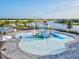 Splash park features small slides, bucket drop, and water features, all in a clean, modern design at 14835 Lyla Ter, Bradenton, FL 34211