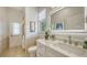 Bright bathroom with a modern vanity, elegant tile accents, and a glass-enclosed shower at 1864 Goldenrod St, Sarasota, FL 34239