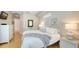 Comfortable bedroom with white furniture, hardwood floors, and natural light at 1864 Goldenrod St, Sarasota, FL 34239