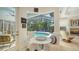 Breakfast nook with pool view and access to both living room and outdoor sitting area at 1864 Goldenrod St, Sarasota, FL 34239