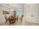 Dining room showcasing wood table, unique chairs, and a decorative cabinet at 1864 Goldenrod St, Sarasota, FL 34239
