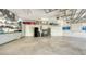 Spacious two-car garage with tool storage, shelving and overhead storage at 1864 Goldenrod St, Sarasota, FL 34239