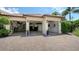 Spacious three-car garage with ample storage and a well-maintained brick driveway at 1864 Goldenrod St, Sarasota, FL 34239
