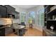 Bright home office featuring custom built-ins and views of exterior landscaping at 1864 Goldenrod St, Sarasota, FL 34239
