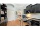 Bright home office has custom desk with great view to living room and front door at 1864 Goldenrod St, Sarasota, FL 34239