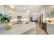 Modern kitchen with a white marble island, pendant lighting, stainless steel appliances, and stylish cabinetry at 1864 Goldenrod St, Sarasota, FL 34239
