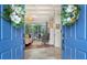 View through the front doors to a living room with fireplace and hardwood flooring at 1864 Goldenrod St, Sarasota, FL 34239