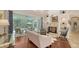 Living room with hardwood floors, fireplace, view of patio and bright, natural light at 1864 Goldenrod St, Sarasota, FL 34239