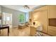 Office features a desk and chair, sleeper cabinet, and a comfortable lounge chair at 1864 Goldenrod St, Sarasota, FL 34239