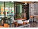 Modern restaurant exterior with an indoor/outdoor dining area with wood tables and chairs at 1864 Goldenrod St, Sarasota, FL 34239