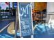 An A-frame sign for Morton's Gourmet Market near shopping carts at 1864 Goldenrod St, Sarasota, FL 34239