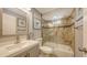 Bathroom with tile walls, glass door, modern fixtures, shower and a neutral color palette at 2420 Webber St, Sarasota, FL 34239