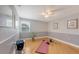 Bright bedroom with hardwood floors, light gray walls, and plenty of room for a home gym or yoga space at 2420 Webber St, Sarasota, FL 34239