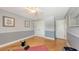 Bedroom featuring hardwood floors, bright light from the window, neutral paint and closet space at 2420 Webber St, Sarasota, FL 34239