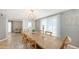 Bright dining room featuring a large wood table, decorative rug, and natural light at 2420 Webber St, Sarasota, FL 34239