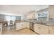 Kitchen with granite countertops and stainless steel appliances and a view to the dining room at 2420 Webber St, Sarasota, FL 34239