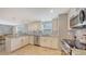 Bright, modern kitchen with stainless steel appliances and granite countertops at 2420 Webber St, Sarasota, FL 34239