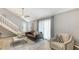 A well-lit living room with a comfy sofa, chair, and elegant decor for relaxation and entertainment at 2420 Webber St, Sarasota, FL 34239