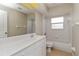 This bathroom has a mirror above a vanity and a shower/tub combination at 2662 6Th E Ct, Ellenton, FL 34222
