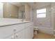 This bathroom has a mirror above a vanity and a shower/tub combination at 2662 6Th E Ct, Ellenton, FL 34222