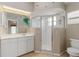 Bright bathroom with white cabinets, a walk-in shower, and neutral colored walls at 2662 6Th E Ct, Ellenton, FL 34222