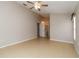 Spacious bedroom with tile floors and ceiling fan, offering a bright and airy space at 2662 6Th E Ct, Ellenton, FL 34222