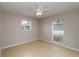 Comfortable bedroom featuring neutral walls, tile flooring, and a window at 2662 6Th E Ct, Ellenton, FL 34222