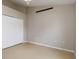 Bright bedroom featuring tile floors, a ceiling fan and a closet at 2662 6Th E Ct, Ellenton, FL 34222