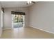 Bedroom featuring tile floors and sliding doors that lead to a screened-in pool at 2662 6Th E Ct, Ellenton, FL 34222