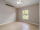 Bright bedroom featuring tile floors and a window overlooking green space at 2662 6Th E Ct, Ellenton, FL 34222