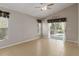 Bedroom featuring tile floors and sliding doors that lead to a screened-in pool at 2662 6Th E Ct, Ellenton, FL 34222
