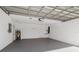 Clean and spacious garage with painted floor and water heater at 2662 6Th E Ct, Ellenton, FL 34222