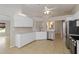 Well-lit kitchen with white cabinetry and stainless steel dishwasher at 2662 6Th E Ct, Ellenton, FL 34222