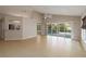 Open-concept living space with tile flooring, access to the patio, and a view of the pool at 2662 6Th E Ct, Ellenton, FL 34222