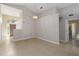 Bright open living area with neutral walls, tile floors, and a view of the entryway at 2662 6Th E Ct, Ellenton, FL 34222