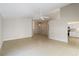Large living area with tile floors, neutral walls, and an open view of the kitchen at 2662 6Th E Ct, Ellenton, FL 34222