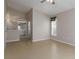 Main bedroom featuring tile floors and an ensuite bathroom with walk-in closet at 2662 6Th E Ct, Ellenton, FL 34222