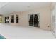 Spacious patio area next to the screened-in pool with multiple entrances to the home at 2662 6Th E Ct, Ellenton, FL 34222