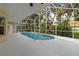 Screened-in pool with lush landscaping, perfect for outdoor relaxation and entertainment at 2662 6Th E Ct, Ellenton, FL 34222