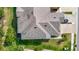 Aerial view showcasing the roof of the home, landscaped yard, and access to community streets at 30073 Southwell Ln, Wesley Chapel, FL 33543
