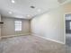 Bright bedroom with neutral carpeting, a large window, and ample natural light at 30073 Southwell Ln, Wesley Chapel, FL 33543