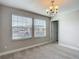 A light, airy bedroom featuring two windows with view and neutral color palette at 30073 Southwell Ln, Wesley Chapel, FL 33543
