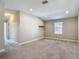 Bedroom with a cozy carpet, window, and a shelf at 30073 Southwell Ln, Wesley Chapel, FL 33543