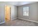 Cozy bedroom with carpet, neutral walls, and a window to let natural light in at 30073 Southwell Ln, Wesley Chapel, FL 33543