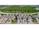 Townhomes with well maintained landscaping and driveways are situated near green space and water features at 30073 Southwell Ln, Wesley Chapel, FL 33543