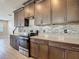 Modern kitchen with stainless steel appliances, stylish backsplash, and plentiful counter space at 30073 Southwell Ln, Wesley Chapel, FL 33543